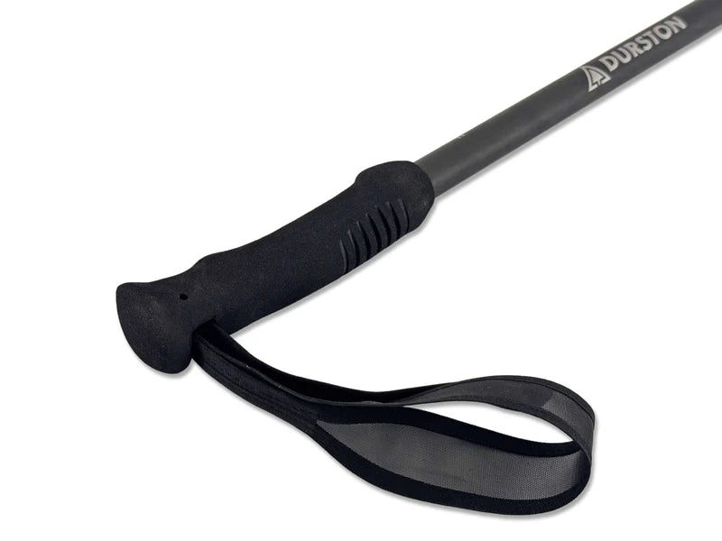 Black walking stick with a black strap on a white background, featuring the Durston brand.