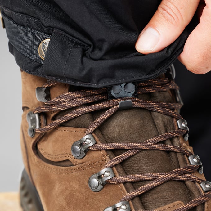 Fjallraven Men's Keb Trousers Model Kneel Close Up Leg Lower Detail Near Shoes Buckle