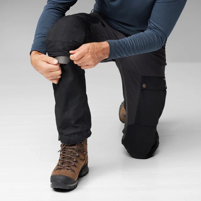 Fjallraven Men's Keb Trousers Model Kneel Close Up Leg Stretch Open Zip Knee Stretch
