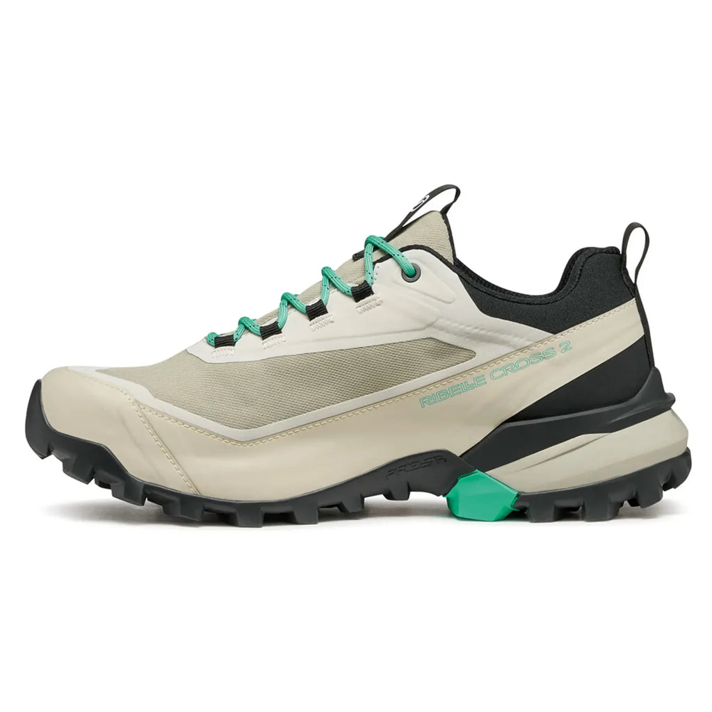 Beige and black hiking shoe with green accents on a white background