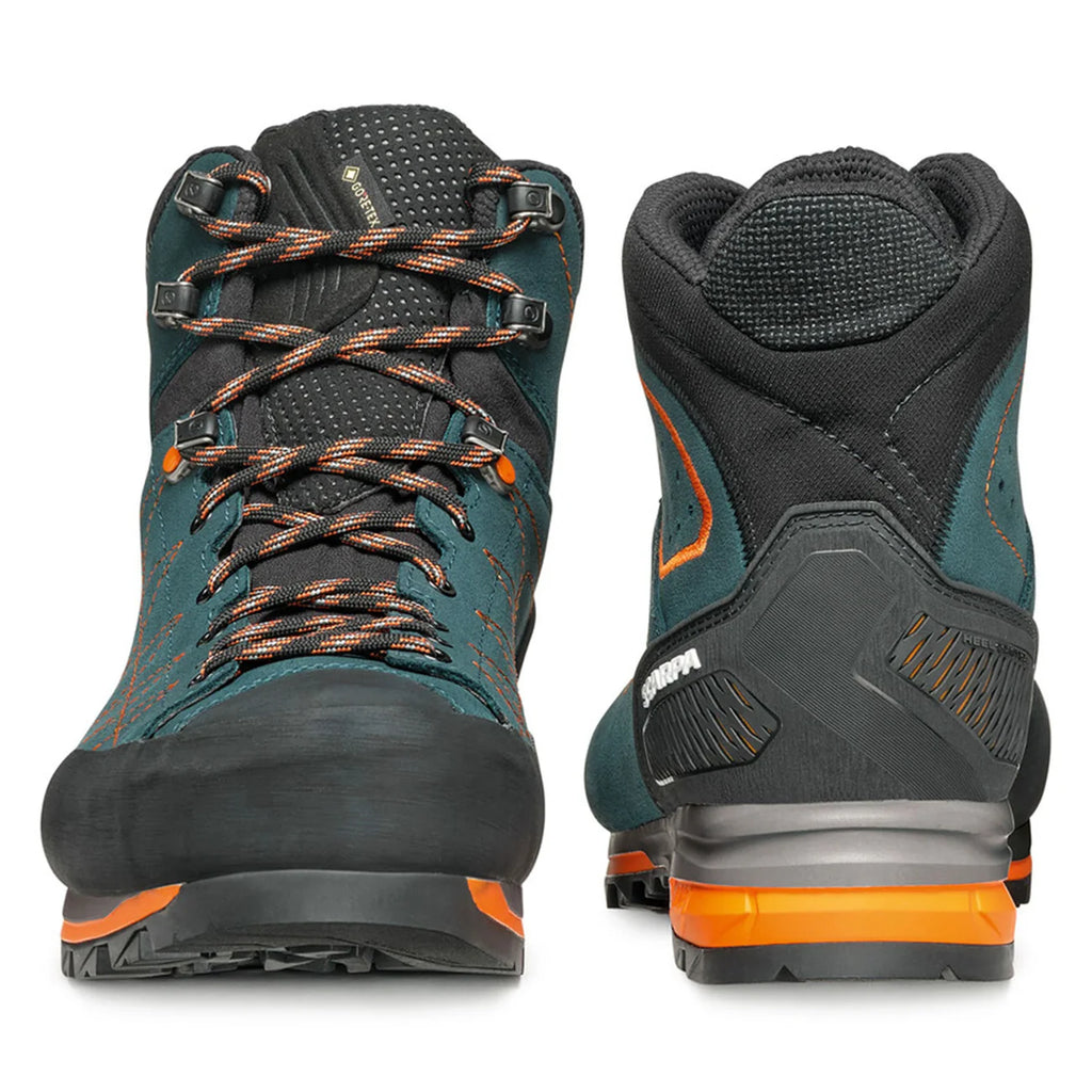 Pair of hiking boots with teal, black, and orange design on a white background
