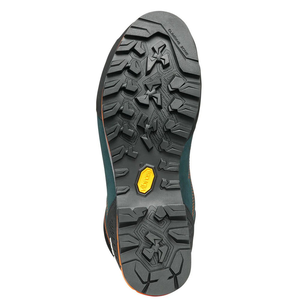 Close-up of a hiking boot sole with tread pattern and brand logo on a white background