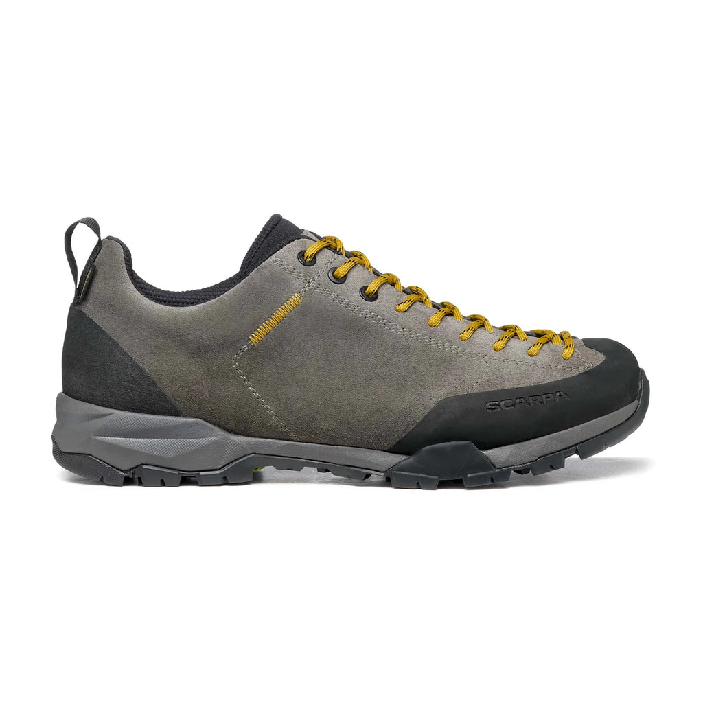 Gray hiking shoe with yellow laces on a white background