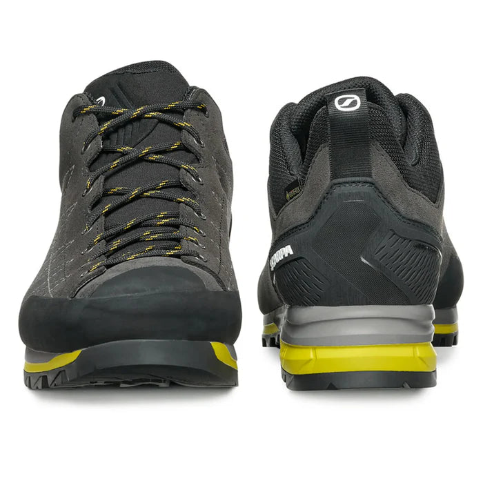 Black and gray shoes with yellow accents on a white background