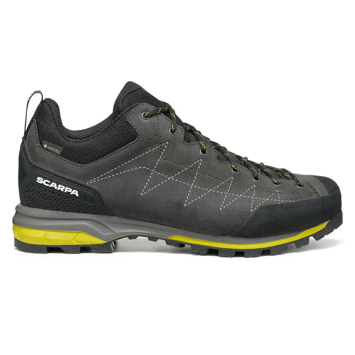 Gray hiking shoe with yellow sole on a white background