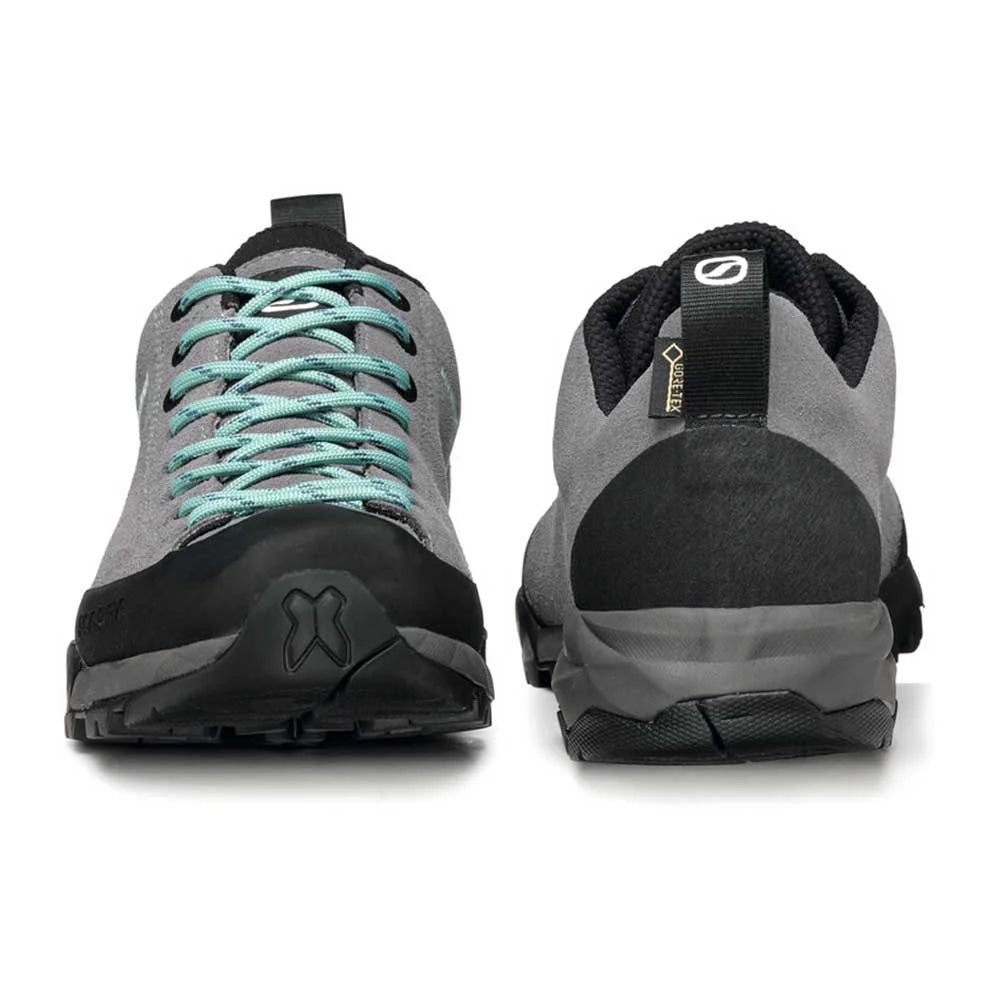 Gray and black hiking shoes with teal laces on a white background