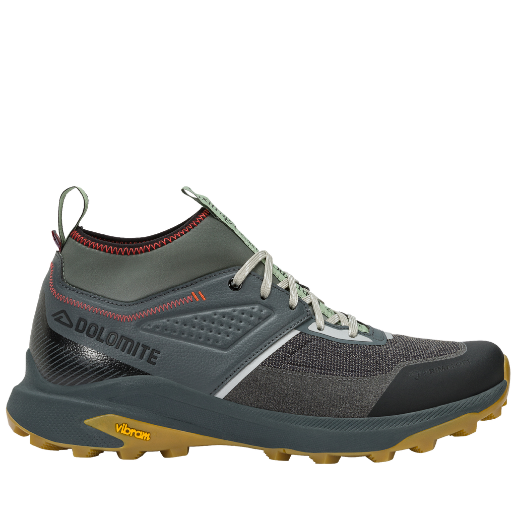Gray hiking shoe with yellow sole on a white background